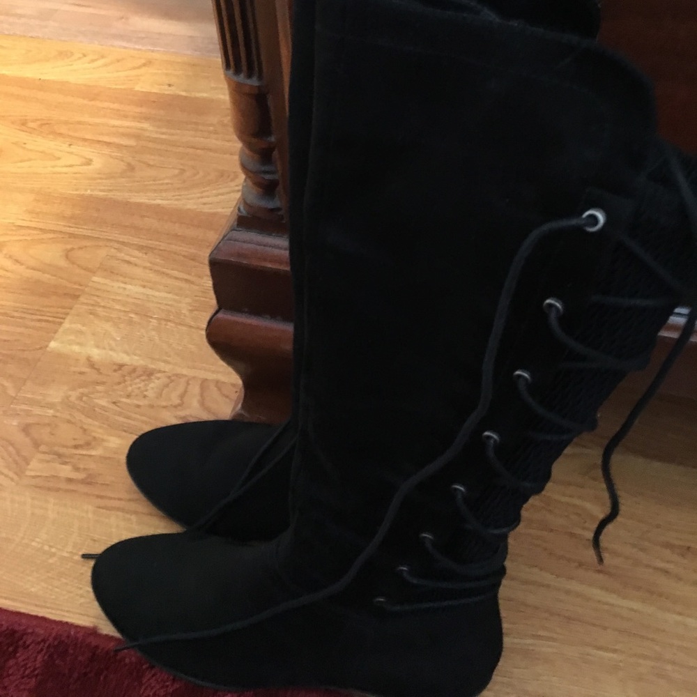 Black boots that tie up the back